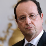 French President Francois Hollande listens to the speech of French Prime Minister during a new year ceremony with members of the government at the Elysee Palace in Paris on January 3, 2014.    AFP PHOTO / POOL / PHILIPPE WOJAZER        (Photo credit should read PHILIPPE WOJAZER/AFP/Getty Images)