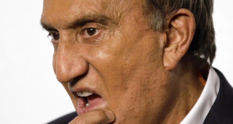 In this photo taken on Sept. 27, 2010, Italian journalist Emilio Fede touches his chin, in Milan, Italy. A Milan court, Friday, July 19, 2013 has convicted three of ex-premier Silvio Berlusconi's former aides of procuring prostitutes for the media mogul's infamous "bunga bunga" parties. The court Friday handed out stiff sentences to Emilio Fede, a longtime executive in the mogul's TV networks; Dario Mora, a talent agent, and Nicole Minetti, a former regional politician who professed love for the ex-premier. Berlusconi wasn't on trial in this case, but was convicted separately last month of paying for sex with a minor and trying to cover it up. Prostitution among adults is legal but exploiting prostitutes is a crime. (AP Photo/Luca Bruno)