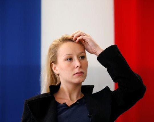 Marion Marechal-Le Pen, French National Front political party member and current deputy in Parliament, attends during an interview with Reuters as she campaigns for the upcoming regional election for the Provence-Alpes-Cote d'Azur (PACA) region in Carpentras, France, November 10, 2015. REUTERS/Jean-Paul Pelissier