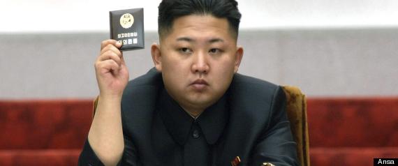 epa03309465 A fiile picture released by the North Korean Central News Agency (KCNA) on 14 April 2012 shows North Korean leader Kim Jong-un holding up a card at the Fifth Session of the 12th Supreme People's Assembly at the Mansudae Assembly Hall in Pyongyang, North Korea, on 13 April 2012. Kim Jong-un was named Marshal of the North Korean army, North Korean media announced on 18 July 2012.  EPA/KCNA SOUTH KOREA OUT