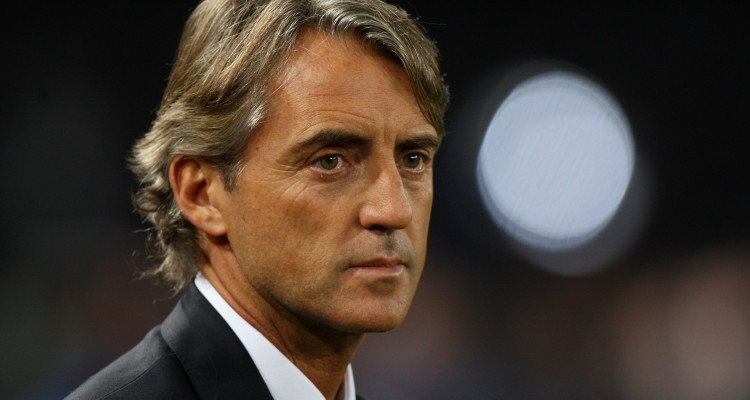 NAPLES, ITALY - NOVEMBER 22:  Roberto Mancini the coach of Manchester City FC reacts during the UEFA Champions League Group A match between SSC Napoli and Manchester City FC at Stadio San Paolo on November 22, 2011 in Naples, Italy.  (Photo by Paolo Bruno/Getty Images)