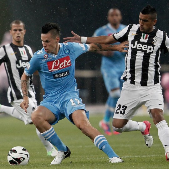 BEIJING, CHINA - AUGUST 11: Marek Hamsik (#17) of SSC Napoli challenges Arturo Vidal (R) of Juventus FC during the Italian Super Cup 2012 match at China's National Stadium on August 11, 2012 in Beijing, China.  (Photo by Lintao Zhang/Getty Images)